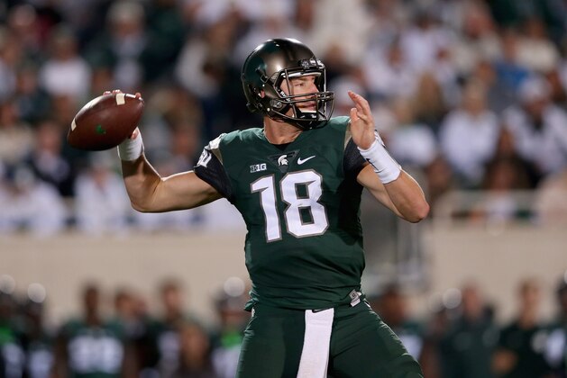EAST LANSING, MI - SEPTEMBER 12:  Connor Cook #18 of the Michigan State Spartans drops back to pass against the Oregon Ducks during their game at Spartan Stadium on September 12, 2015 in East Lansing, Michigan.  (Photo by Streeter Lecka/Getty Images)