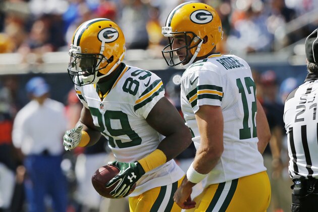 Green Bay Packers quarterback Aaron Rodgers (12) celebrates a touchdown with wide receiver James Jones (89) during the first half an NFL football game against the Chicago Bears, Sunday, Sept. 13, 2015, in Chicago. (AP Photo/Charles Rex Arbogast)