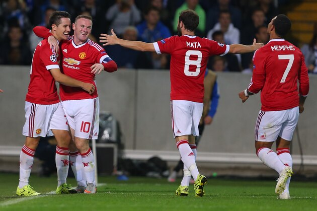 BRUGGE, BELGIUM - AUGUST 26: Wayne Rooney of Manchester United celebrates after he scores a goal to make it 0-2 with Ander Herrera, Juan Mata and Memphis Depay of Manchester United during the UEFA Champions League Qualifying Round Play Off Second Leg between Club Brugge and Manchester United on August 26, 2015 in Brugge, Belgium. (Photo by Catherine Ivill - AMA/Getty Images)