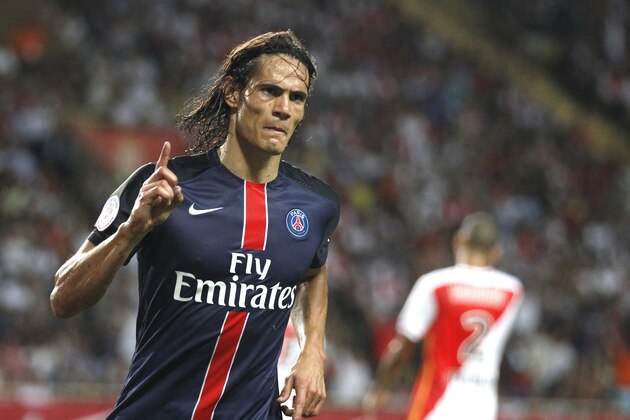 PSG player Edinson Cavani reacts after scoring his second goal against Monaco during their French League One soccer match, in Monaco stadium, Sunday, Aug. 30, 2015. (AP Photo/Lionel Cironneau)