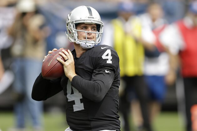 Oakland Raiders quarterback Derek Carr (4) passes against the Cincinnati Bengals during the first half of an NFL football game in Oakland, Calif., Sunday, Sept. 13, 2015. (AP Photo/Ben Margot)