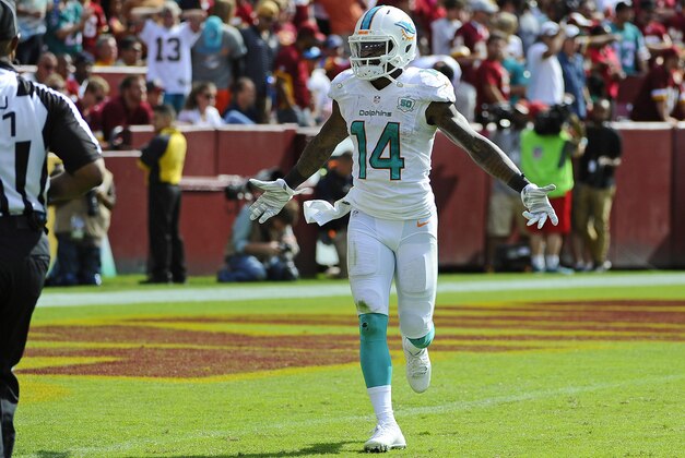 Sep 13, 2015; Landover, MD, USA; Miami Dolphins wide receiver Jarvis Landry (14) celebrates after scoring a touchdown against the Washington Redskins during the second half at FedEx Field. Mandatory Credit: Brad Mills-USA TODAY Sports