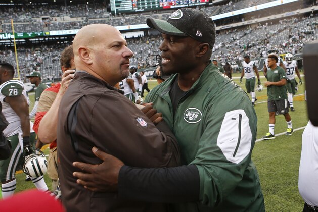 Cleveland Browns head coach Mike Pettine, left, greets New York Jets head coach Todd Bowles after an NFL football game Sunday, Sept. 13, 2015 in East Rutherford, N.J. The Jets won 31-10. (AP Photo/Jason DeCrow)