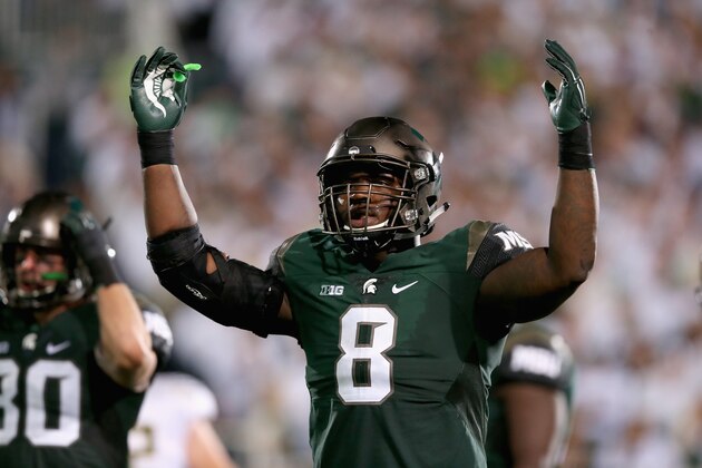 EAST LANSING, MI - SEPTEMBER 12:  Lawrence Thomas #8 of the Michigan State Spartans gets the crowd involved against the Oregon Ducks during their game at Spartan Stadium on September 12, 2015 in East Lansing, Michigan.  (Photo by Streeter Lecka/Getty Images)