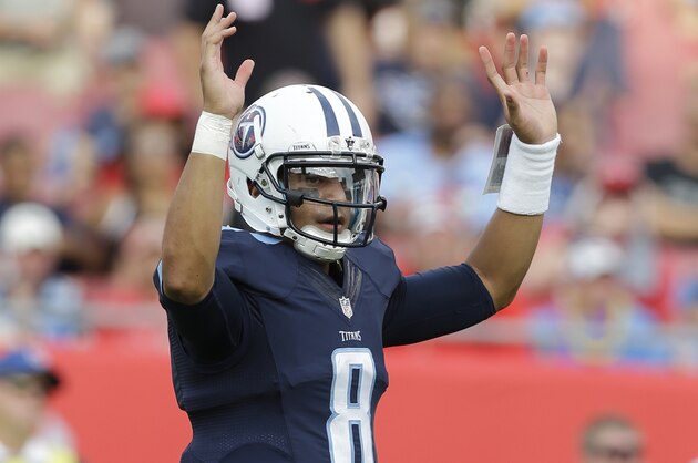 Tennessee Titans quarterback Marcus Mariota (8) celebrates a touchdown during the second half of an NFL football game against the Tampa Bay Buccaneers, Sunday, Sept. 13, 2015, in Tampa , Fla. (AP Photo/Chris O'Meara)