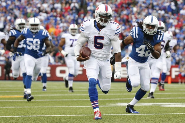 Buffalo Bills quarterback Tyrod Taylor (5) runs against the Indianapolis Colts during the first half of an NFL football game on Sunday, Sept. 13, 2015, in Orchard Park, N.Y. (AP Photo/Bill Wippert)