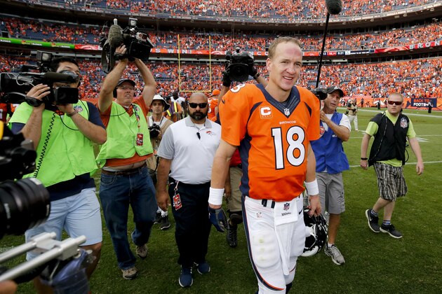 Denver Broncos quarterback Peyton Manning walks off the field after their  win against the Baltimore Ravens in an NFL football game Sunday, Sept. 13, 2015, in Denver. (AP Photo/Jack Dempsey)