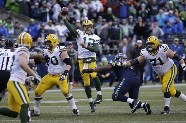 Green Bay Packers quarterback Aaron Rodgers (12) throws against the Seattle Seahawks during the second half of the NFL football NFC Championship game Sunday, Jan. 18, 2015, in Seattle. (AP Photo/David J. Phillip)