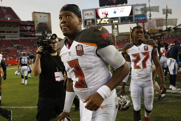 Tampa Bay Buccaneers quarterback Jameis Winston (3) leaves the field at the end of an NFL football game against the Tennessee Titans, Sunday, Sept. 13, 2015, in Tampa, Fla. The Titans defeated the Bucs42-14.  (AP Photo/Brian Blanco)