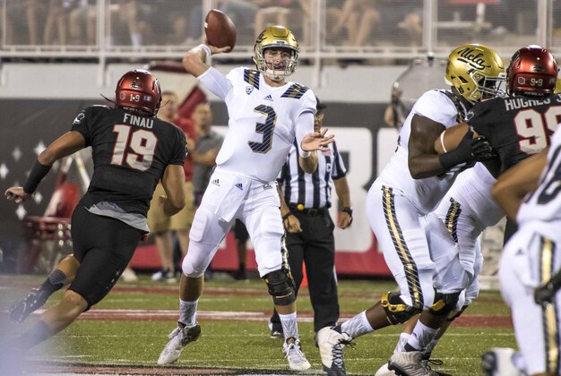 Sep 12, 2015; Las Vegas, NV, USA; UCLA Bruins quarterback Josh Rosen (3) throws the ball as UNLV Rebels defensive lineman Mark Finau (19) rushes him during the first quarter at Sam Boyd Stadium. Mandatory Credit: Joshua Dahl-USA TODAY Sports