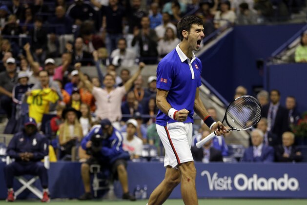 Novak Djokovic, of Serbia, reacts after breaking Roger Federer's serve to win a game in the fourth set during the men's championship match of the U.S. Open tennis tournament, Sunday, Sept. 13, 2015, in New York. (AP Photo/David Goldman)