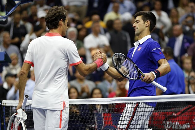 Novak Djokovic, of Serbia, right, greets Roger Federer, of Switzerland, after winning the men's championship match of the U.S. Open tennis tournament, Sunday, Sept. 13, 2015, in New York. (AP Photo/Julio Cortez)