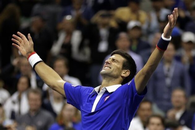 Novak Djokovic, of Serbia, reacts after defeating Roger Federer, of Switzerland, in the men's championship match of the U.S. Open tennis tournament, Sunday, Sept. 13, 2015, in New York. (AP Photo/David Goldman)