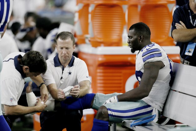 Dallas Cowboys wide receiver Dez Bryant (88) is tended to on the sideline after injuring his foot during the second half of an NFL football game against the New York Giants Sunday, Sept. 13, 2015, in Arlington, Texas. (AP Photo/Brandon Wade) Dallas Cowboys wide receiver Dez Bryant (88) is tended to on the sideline after injuring his foot during the second half of an NFL football game against the New York Giants Sunday, Sept. 13, 2015, in Arlington, Texas. (AP Photo/Brandon Wade)