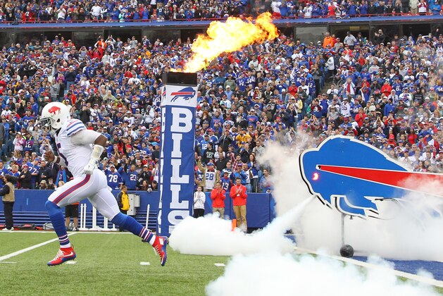 Buffalo Bills quarterback Tyrod Taylor (5) is introduced before an NFL football game against the Indianapolis Colts on Sunday, Sept. 13, 2015, in Orchard Park, N.Y. (AP Photo/Bill Wippert)