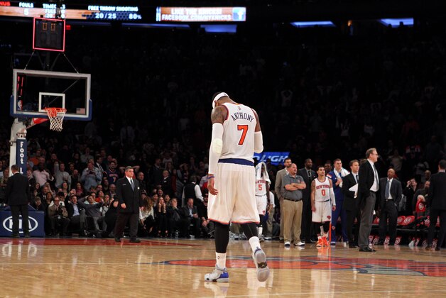 Nov 14, 2014; New York, NY, USA; New York Knicks small forward Carmelo Anthony (7) reacts after the fourth quarter against the Utah Jazz at Madison Square Garden. The Jazz defeated the Knicks 102-100. Mandatory Credit: Brad Penner-USA TODAY Sports