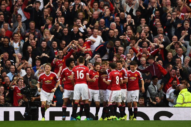 MANCHESTER, ENGLAND - SEPTEMBER 12: Daley Blind of Manchester United celebrates scoring the opening goal with team mates during the Barclays Premier League match between Manchester United and Liverpool at Old Trafford on September 12, 2015 in Manchester, United Kingdom.  (Photo by Laurence Griffiths/Getty Images)