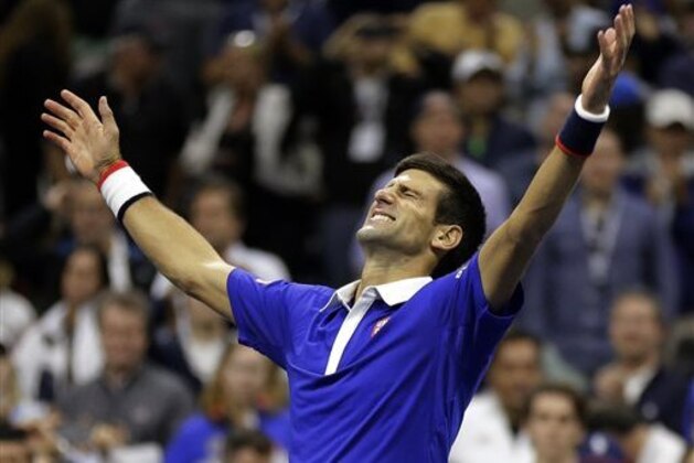 Novak Djokovic, of Serbia, reacts after defeating Roger Federer, of Switzerland, in the men's championship match of the U.S. Open tennis tournament, Sunday, Sept. 13, 2015, in New York. (AP Photo/David Goldman)