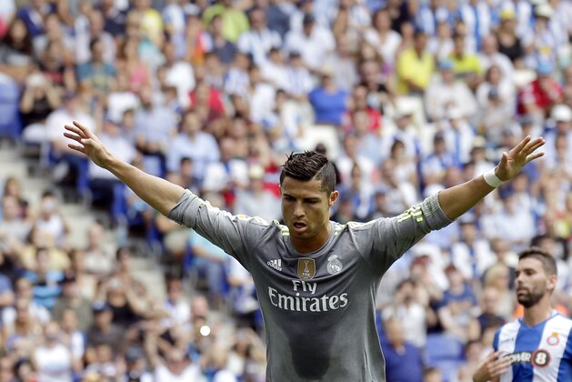 Real Madrid's Cristiano Ronaldo celebrates after scoring against Espanyol during a Spanish La Liga soccer match  at Cornella-El Prat stadium in Cornella Llobregat, Spain, Saturday, Sept. 12, 2015. (AP Photo/Manu Fernandez)