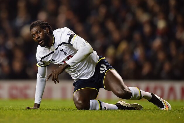 LONDON, ENGLAND - JANUARY 21:  Emmanuel Adebayour of Spurs pulls himself to his feet during the Capital One Cup Semi-Final first leg match between Tottenham Hotspur and Sheffield United at White Hart Lane on January 21, 2015 in London, England.  (Photo by Jamie McDonald/Getty Images)
