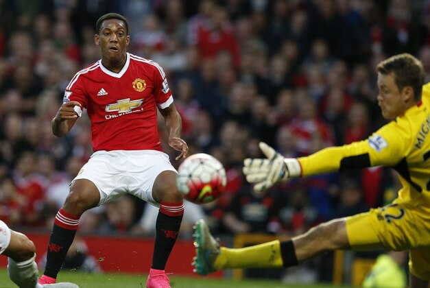 Manchester United's Anthony Martial scores past Liverpool's Simon Mignolet during the English Premier League soccer match between Manchester United and Liverpool at Old Trafford Stadium, Manchester, England, Saturday, Sept. 12, 2015. (AP Photo/Jon Super)