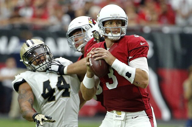 Arizona Cardinals quarterback Carson Palmer (3) looks to pass against the New Orleans Saints during the first half of an NFL football game, Sunday, Sept. 13, 2015, in Glendale, Ariz. (AP Photo/Ross D. Franklin)