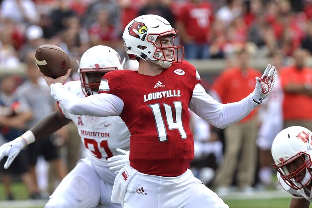 Louisville's Kyle Bolin (14) attempts a pass during the second half of an NCAA college football game against Houston in Louisville, Ky. Saturday, Sept. 12, 2015. Houston defeated Louisville 34-31. (AP Photo/Timothy D. Easley)