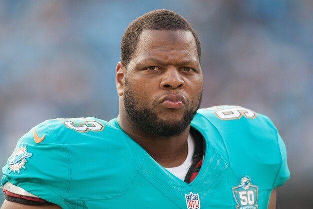 Aug 22, 2015; Charlotte, NC, USA; Miami Dolphins defensive tackle Ndamukong Suh (93) stands on the sidelines during the first quarter against the Carolina Panthers at Bank of America Stadium. Mandatory Credit: Jeremy Brevard-USA TODAY Sports