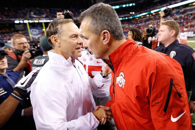 INDIANAPOLIS, IN - DECEMBER 07: Head coach Mark Dantonio of the Michigan State Spartans shakes hands with head coach Urban Meyer of the Ohio State Buckeyes after defeating the Buckeyes 34-24 to win the Big 10 Conference Championship Game at Lucas Oil Stadium on December 7, 2013 in Indianapolis, Indiana. (Photo by Gregory Shamus/Getty Images) INDIANAPOLIS, IN - DECEMBER 07: Head coach Mark Dantonio of the Michigan State Spartans shakes hands with head coach Urban Meyer of the Ohio State Buckeyes after defeating the Buckeyes 34-24 to win the Big 10 Conference Championship Game at Lucas Oil Stadium on December 7, 2013 in Indianapolis, Indiana. (Photo by Gregory Shamus/Getty Images)