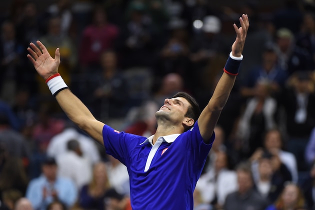 Novak Djokovic of Serbia celebrates his victory over Roger Federer of Switzerland during their US Open 2015 men's single final match at the USTA Billie Jean King National Center September 13, 2015  in New York. AFP PHOTO/JEWEL SAMAD        (Photo credit should read JEWEL SAMAD/AFP/Getty Images)