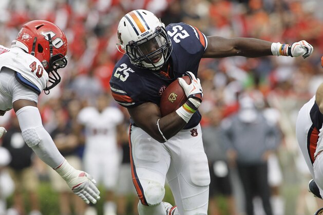 Sep 12, 2015; Auburn, AL, USA;  Auburn Tigers running back Peyton Barber (25) gets past Jacksonville State Gamecocks defensive end Darius Jackson (40) during overtime at Jordan Hare Stadium.  The Tigers beat the Gamecocks 27-20. Mandatory Credit: John Reed-USA TODAY Sports