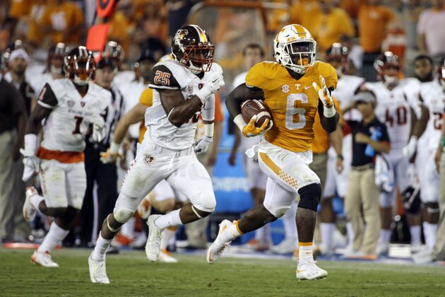 Tennessee running back Alvin Kamara (6) gets past Bowling Green defensive back Nilijah Ballew (25) in the second half of an NCAA college football game Saturday, Sept. 5, 2015, in Nashville, Tenn. Tennessee won 59-30. (AP Photo/Mark Humphrey)