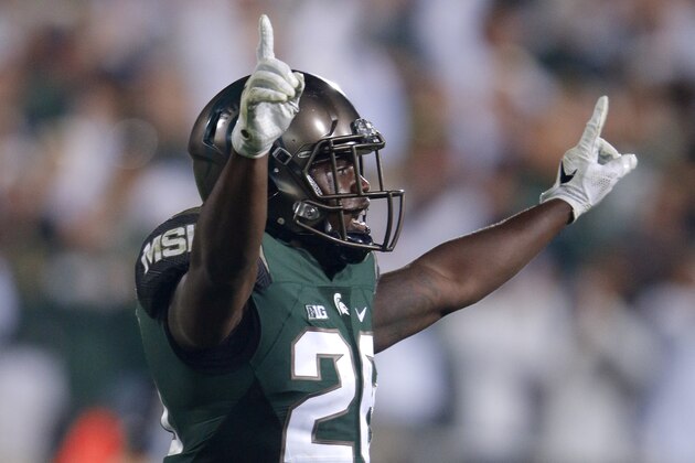 Michigan State's R.J. Williamson celebrates after the Spartans stopped Oregon's fourth down attempt with about a minute remaining in the fourth quarter of an NCAA college football game, Saturday, Sept. 12, 2015, in East Lansing, Mich. Michigan State won 31-28. (AP Photo/Al Goldis)