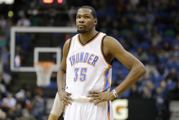 Oklahoma City Thunder forward Kevin Durant (35) watches a free-throw during the fourth quarter of an NBA basketball game against the Minnesota Timberwolves in Minneapolis, Friday, Dec. 12, 2014. The Thunder won 111-92. (AP Photo/Ann Heisenfelt)