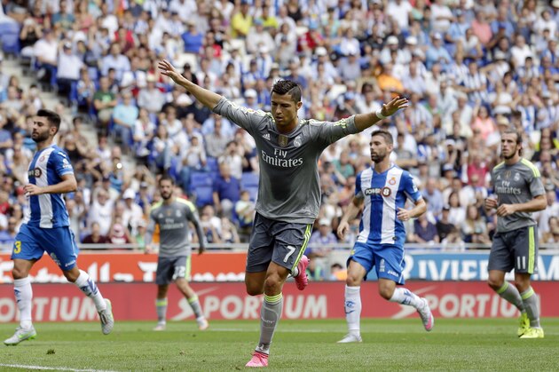 Real Madrid's Cristiano Ronaldo celebrates after scoring against Espanyol during a Spanish La Liga soccer match  at Cornella-El Prat stadium in Cornella Llobregat, Spain, Saturday, Sept. 12, 2015. (AP Photo/Manu Fernandez)