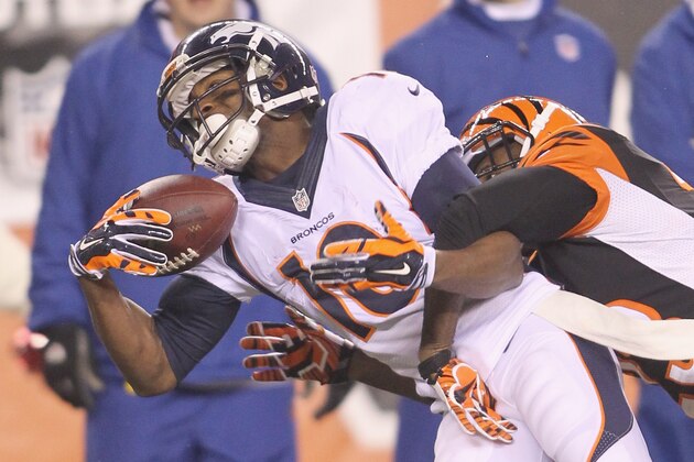 CINCINNATI, OH - DECEMBER 22: Terence Newman #23 of the Cincinnati Bengals battles for the football with Emmanuel Sanders #10 of the Denver Broncos during their game at Paul Brown Stadium on December 22, 2014 in Cincinnati, Ohio. The Bengals defeated the Broncos 37-28. (Photo by John Grieshop/Getty Images)