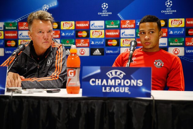 Manchester United's manager Louis van Gaal (L) and Dutch forward Memphis Depay attend a press conference in Eindhoven on September 14, 2015 on the eve of the Champions League Group B football match PSV Eindhoven vs Manchester United. AFP PHOTO / ANP BAS CZERWINSKI netherlands out        (Photo credit should read BAS CZERWINSKI/AFP/Getty Images)