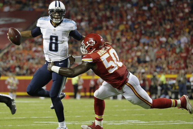 Tennessee Titans quarterback Marcus Mariota (8) is tackled by Kansas City Chiefs linebacker Justin Houston (50) during the first half of a preseason NFL football game at Arrowhead Stadium in Kansas City, Mo., Friday, Aug. 28, 2015. (AP Photo/Charlie Riedel)