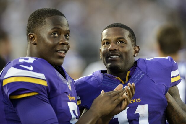 MINNEAPOLIS, MN - AUGUST 15: Teddy Bridgewater #5 and Mike Wallace #11 of the Minnesota Vikings speak during the preseason game against the Tampa Bay Buccaneers on August 15, 2015 at TCF Bank Stadium in Minneapolis, Minnesota. The Vikings defeated the Buccaneers 26-16. (Photo by Hannah Foslien/Getty Images)