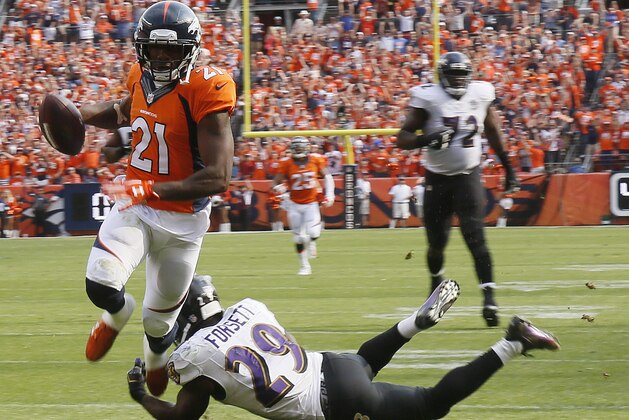 Denver Broncos cornerback Aqib Talib, left, scores past Baltimore Ravens running back Justin Forsett during the second half of an NFL football game Sunday, Sept. 13, 2015, in Denver. (AP Photo/Jack Dempsey)