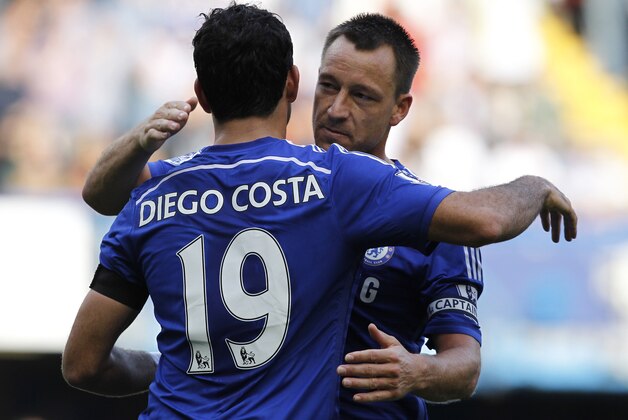 Chelseas Brazilian-born Spanish striker Diego Costa (L) celebrates scoring his third goal with Chelseas English defender John Terry during the English Premier League football match between Chelsea and Swansea City at Stamford Bridge in London on September 13, 2014.  Chelsea won 4-1.  AFP PHOTO/IAN KINGTON - RESTRICTED TO EDITORIAL USE. No use with unauthorized audio, video, data, fixture lists, club/league logos or live services. Online in-match use limited to 45 images, no video emulation. No use in betting, games or single club/league/player publications.        (Photo credit should read IAN KINGTON/AFP/Getty Images)
