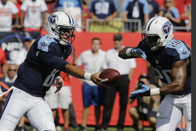 Tennessee Titans quarterback Marcus Mariota (8) hands the ball to running back Bishop Sankey (20 )during the first half of an NFL football game against the Tampa Bay Buccaneers, Sunday, Sept. 13, 2015, in Tampa, Fla. (AP Photo/Chris O'Meara)