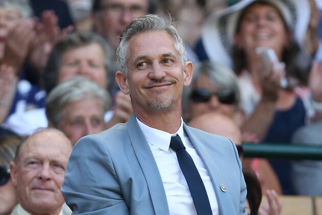 Former England footballer and television presenter Gary Lineker stands and waves in the royal box on centre court before the start of the men's singles third round match between Australia's Samuel Groth and Switzerland's Roger Federer on day six of the 2015 Wimbledon Championships at The All England Tennis Club in Wimbledon, southwest London, on July 4, 2015.   RESTRICTED TO EDITORIAL USE  --   AFP PHOTO / JUSTIN TALLIS        (Photo credit should read JUSTIN TALLIS/AFP/Getty Images)