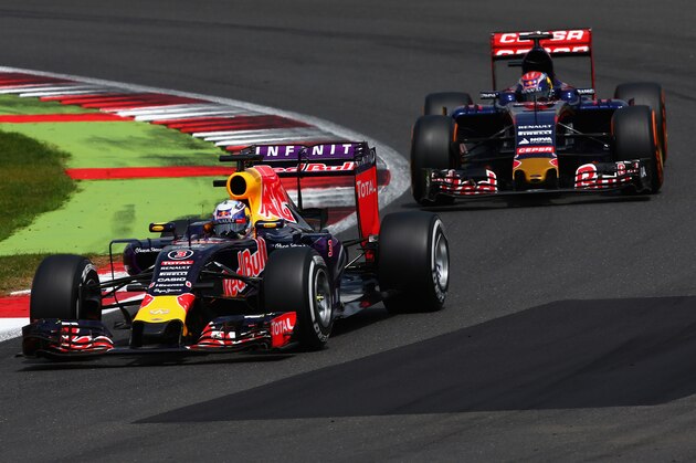 NORTHAMPTON, ENGLAND - JULY 05:  Daniel Ricciardo of Australia and Infiniti Red Bull Racing drives ahead of Max Verstappen of Netherlands and Scuderia Toro Rosso during the Formula One Grand Prix of Great Britain at Silverstone Circuit on July 5, 2015 in Northampton, England.  (Photo by Clive Mason/Getty Images)
