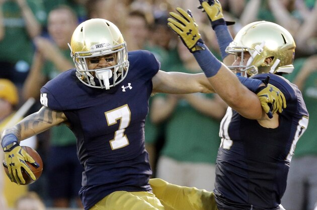 Notre Dame wide receiver Will Fuller, left, celebrates with tight end Durham Smythe after scoring a touchdown during the first half of an NCAA college football game against Texas, Saturday, Sept. 5, 2015, in South Bend, Ind. (AP Photo/Nam Y. Huh)