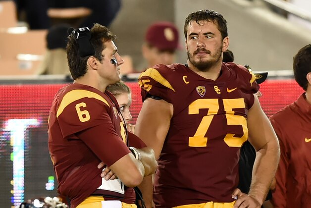 Southern California quarterback Cody Kessler (6) and teammate center Max Tuerk (75) look on from the sidelines during the second half of an NCAA college football game against Idaho, Saturday, Sept. 12, 2015, in Los Angeles. Southern California won 59.(AP Photo/Gus Ruelas)