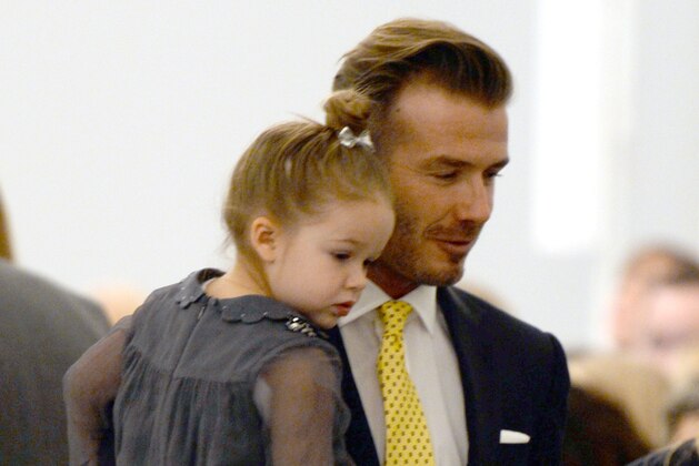 David Beckham and his daughter Harper arrive to watch the presentation of Victoria Beckham's fashions during the Mercedes-Benz Fashion Week Fall/Winter 2014 shows February 9, 2014 in New York City. AFP PHOTO / Don EMMERT (Photo credit should read DON EMMERT/AFP/Getty Images) David Beckham and his daughter Harper arrive to watch the presentation of Victoria Beckham's fashions during the Mercedes-Benz Fashion Week Fall/Winter 2014 shows February 9, 2014 in New York City. AFP PHOTO / Don EMMERT (Photo credit should read DON EMMERT/AFP/Getty Images)