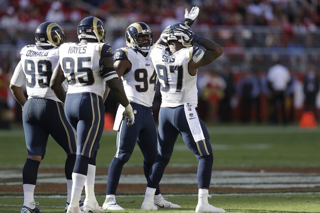 St. Louis Rams defensive tackle Aaron Donald (99), defensive end William Hayes (95), defensive end Robert Quinn (94) and defensive end Eugene Sims (97) celebrate during the second quarter of an NFL football game against the San Francisco 49ers in Santa Clara, Calif., Sunday, Nov. 2, 2014. (AP Photo/Ben Margot)