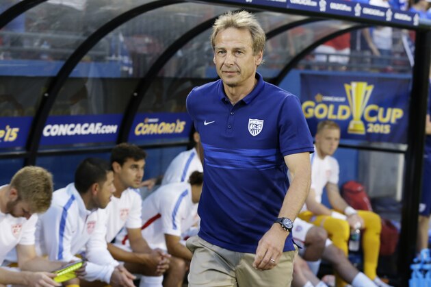 U.S. head soccer coach Jürgen Klinsmann walks onto the field before a CONCACAF Gold Cup opener soccer game against Honduras in Frisco, Texas, Tuesday, July 7, 2015. (AP Photo/LM Otero)