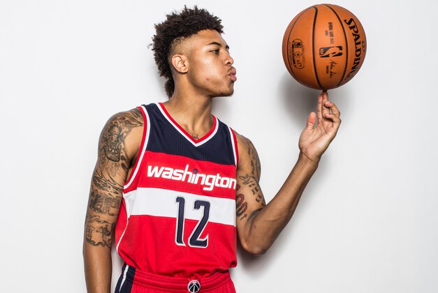 TARRYTOWN, NY - AUGUST 08:  Kelly Oubre Jr. #12 of the Washington Wizards poses for a portrait during the 2015 NBA rookie photo shoot on August 8, 2015 at the Madison Square Garden Training Facility in Tarrytown, New York. NOTE TO USER: User expressly acknowledges and agrees that, by downloading and or using this photograph, User is consenting to the terms and conditions of the Getty Images License Agreement.   (Photo by Nick Laham/Getty Images)